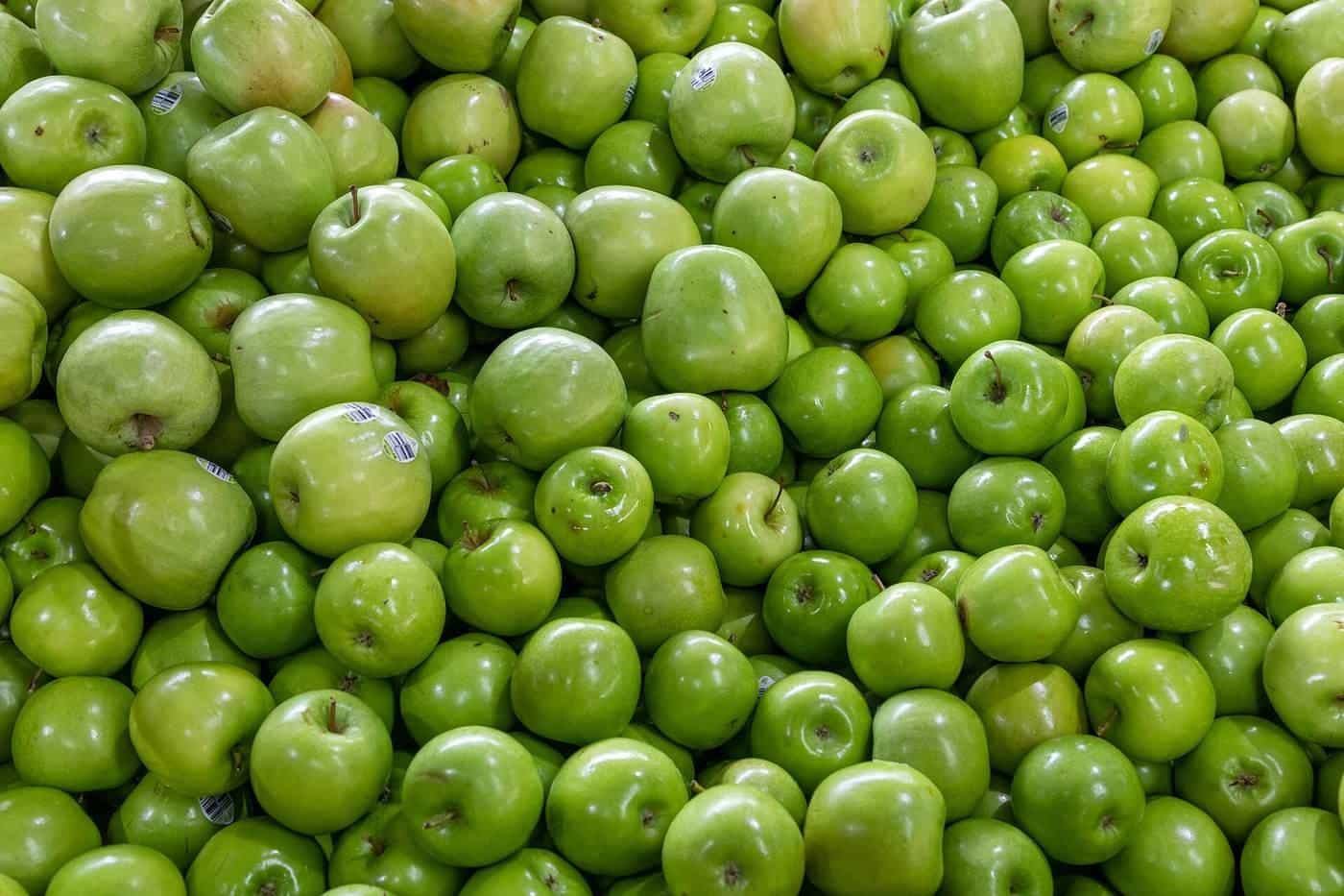 Rows of green apples on display at Queen Victoria Market in Melbourne